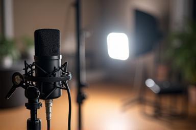 Audio recording equipment and lighting setup on a small set